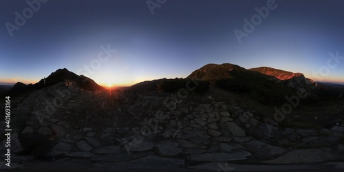 Spherical HDRI Panorama of sunrise in the mountains