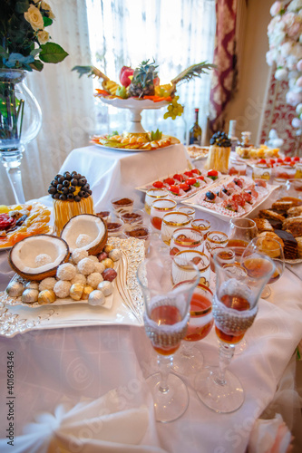 Buffet table with cold appetizers, meat and salads. Sweet snacks