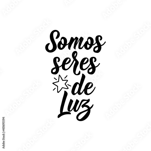 We are beings of light - in Spanish. Lettering. Ink illustration. Modern brush calligraphy.