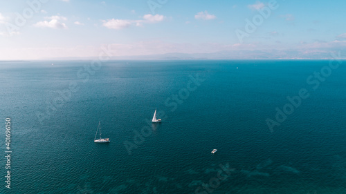 Aerial drone ultra wide photo of sail boat cruising in the deep blue Aegean sea,Turkey