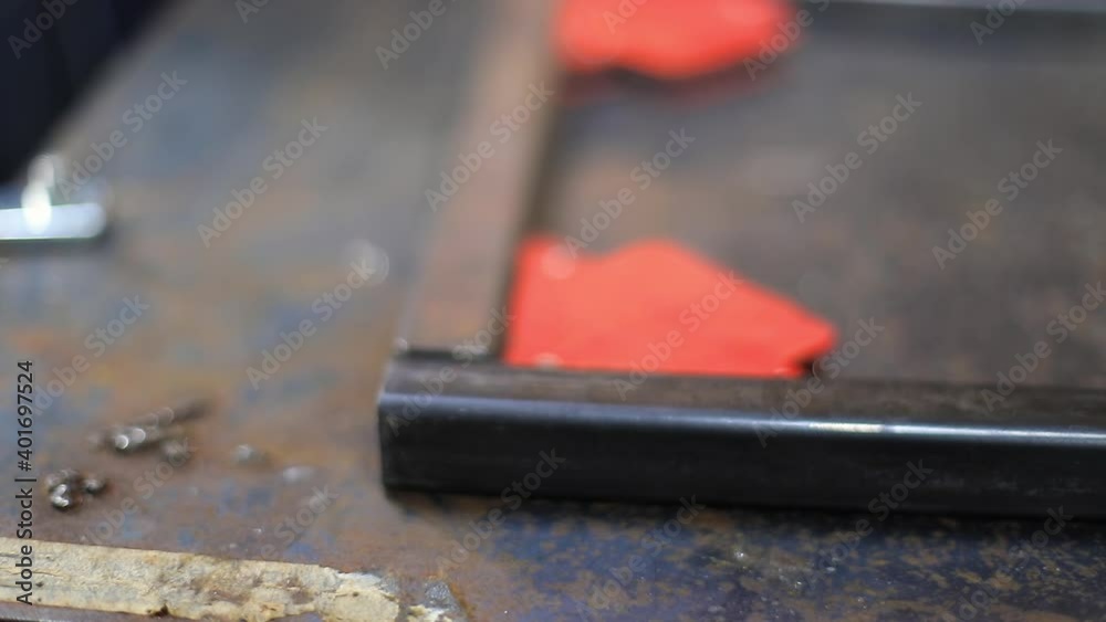 Selective focus of young woman hands, adjusting end of rods on workspace table using magnetic corner for hold and measuring space and angle using ruler Selective focus of young woman hands, adjusting end of rods on workspace table using magnetic corner for hold and measuring space and angle using ruler