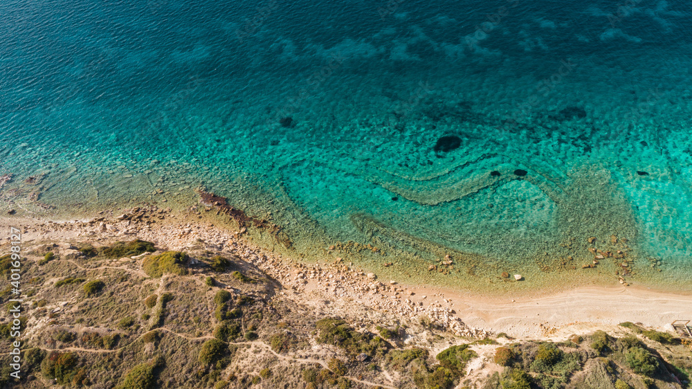 Top view aerial image from drone of an stunning beautiful sea landscape beach with turquoise water with copy space for your text.Beautiful Sand beach with turquoise water. Cesme Izmir Turkey Top view aerial image from drone of an stunning beautiful sea landscape beach with turquoise water with copy space for your text.Beautiful Sand beach with turquoise water. Cesme Izmir Turkey