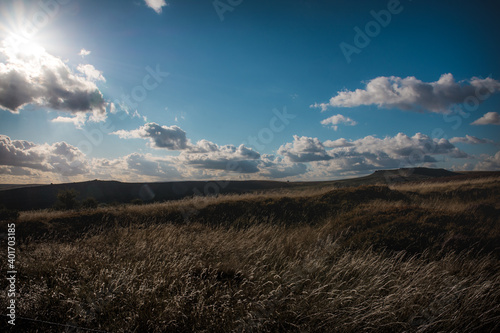low sun over the hills