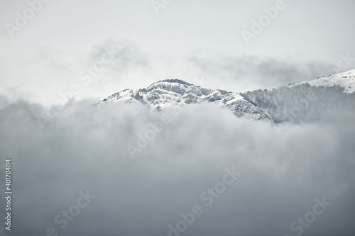 View from above, stunning aerial view of a snow capped mountain range during a cloudy day. Campocatino, Frosinone, Italy.
