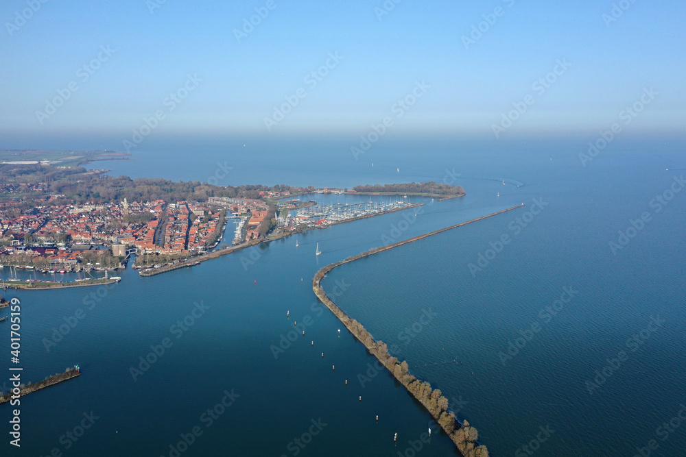 Aerial drone photo of the beautiful historic city of Enkhuizen, with old town marina harbors in the Netherlands