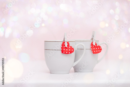 Two cups of coffee, hearts bokeh, Valentine's concept.