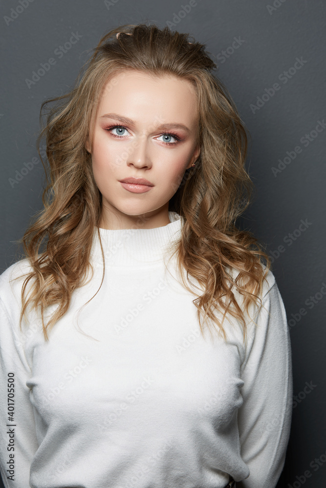 Portrait of beautiful woman model with fresh daily makeup and romantic wavy hairstyle Portrait of beautiful woman model with fresh daily makeup and romantic wavy hairstyle