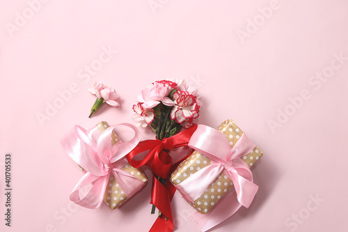 Concept for Valentine's Day or Women's Day. Postcard, hearts, flowers and gift boxes on a pink background, place for text, banner, Happy holidays, congratulations, birthday, wedding,