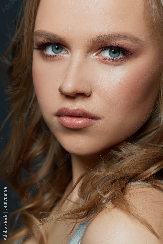Beautiful woman's face with tan. clean skin - isolated on black Beautiful woman's face with tan. clean skin - isolated on black