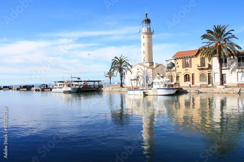 Lighthouse and old fishing port of Grau du roi in Camargue, a resort on the coast of Occitanie region in France  © Picturereflex