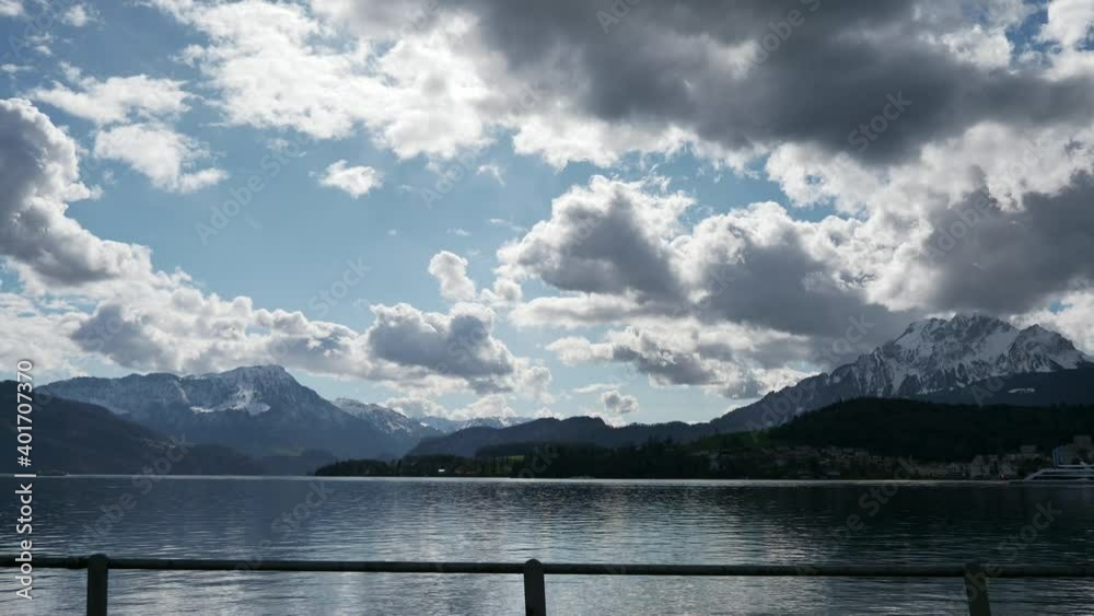 Mountain Lake Lucerne. Alps Switzerland Europe. View out of Car Moving on Highway Quay. Slow motion Mountain Lake Lucerne. Alps Switzerland Europe. View out of Car Moving on Highway Quay. Slow motion