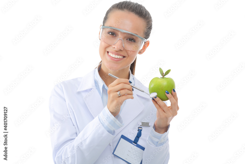 Smiling woman doctor with a green apple. Woman doctor Smiling woman doctor with a green apple. Woman doctor