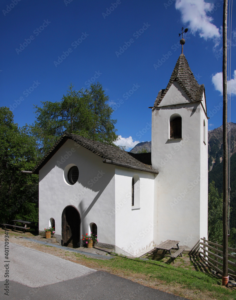 Small neo-romanesque mountain chapel of St Martin in Steinwand, Martell village in the Alps, South Tyrol in Italy