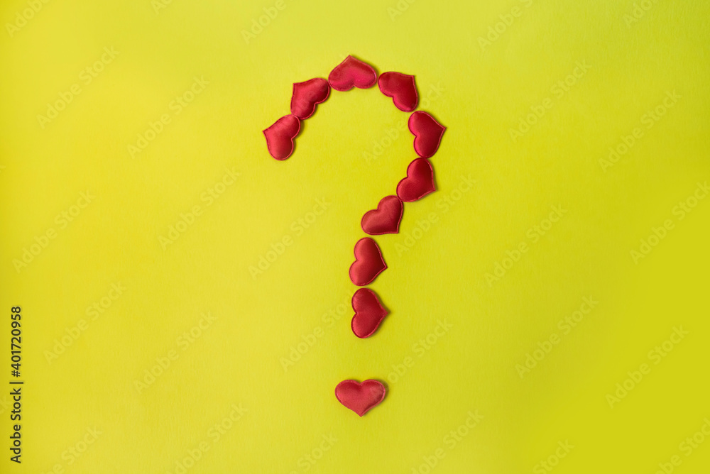 question mark with red heart symbol on yellow background question mark with red heart symbol on yellow background