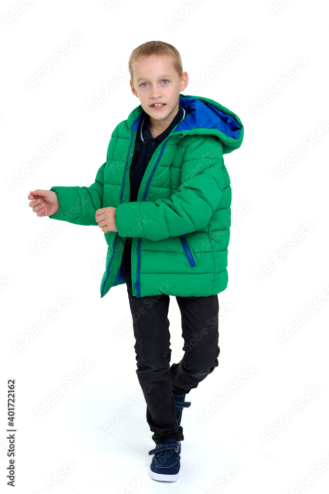 Smiling boy in unbuttoned green winter jacket Smiling boy in unbuttoned green winter jacket