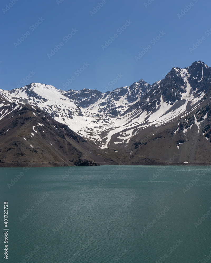 Impressive vertical photo of the Embalse El Yeso, located in San Jose de Maipo known as El Cajon del Maipo in the Andes Mountains, Chilean Patagonia