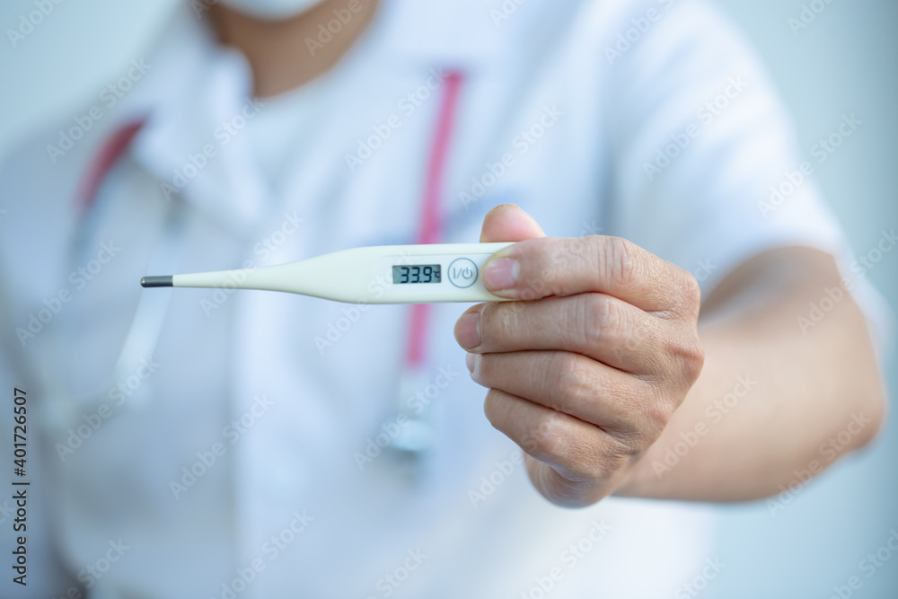 Hand of a doctor showing thermometer with stethoscope. Temperature, fever, flu or ill diagnostic equipment. Hospital tool or instrument. Hand of a doctor showing thermometer with stethoscope. Temperature, fever, flu or ill diagnostic equipment. Hospital tool or instrument.