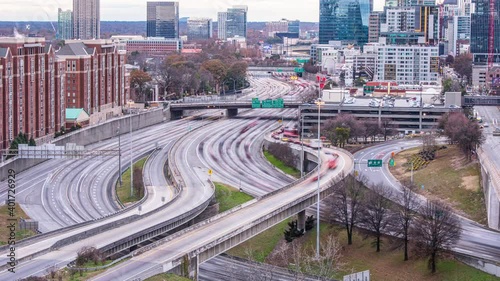 Time Lapse - Panoramic View of I-85 Interstate Freeway Traffic with Downtown Atlanta Skyline at Dusk - 4K