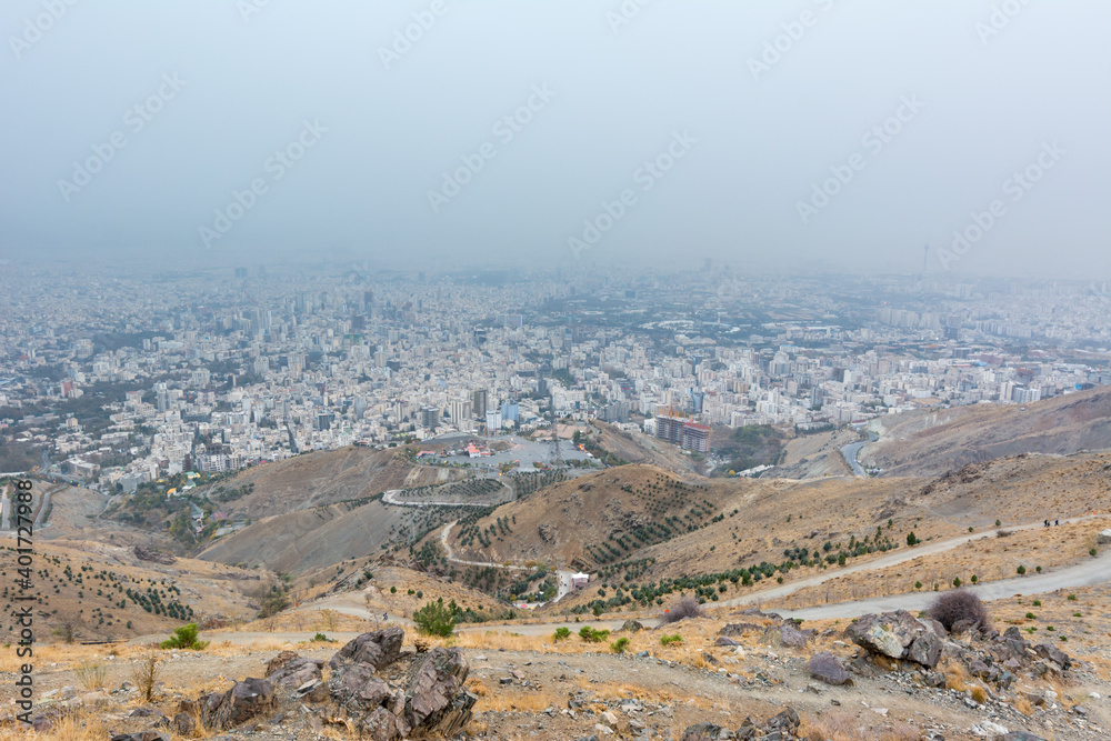 City view of Tehran City with dust and mist and modern buildings, Iran form Tohal mountain. Tochal is a popular recreational region for Tehran's residents