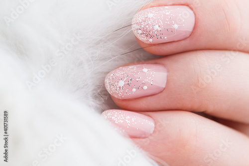 Nails Design. Christmas Manicure isolated on white Background. Close Up Of Female Hands. Art Nail.