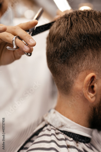 men have their hair cut at the barbershop