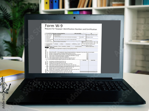 Conceptual photo about  Form W-9 Request for Taxpayer Identification Number and Certification   with handwritten text.