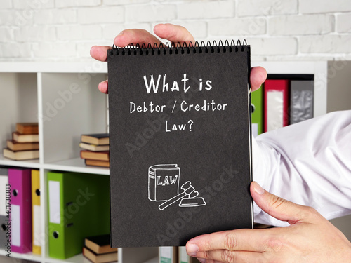Fotografia Business concept meaning Debtor / Creditor Law? with phrase on the page