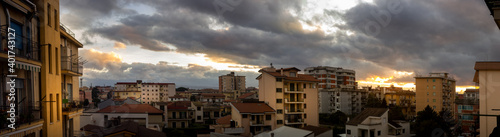 city skyline with sunset clouds of Aversa
