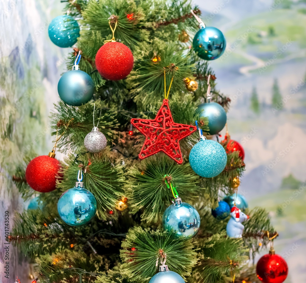 Part of an artificial Christmas tree with toys close-up