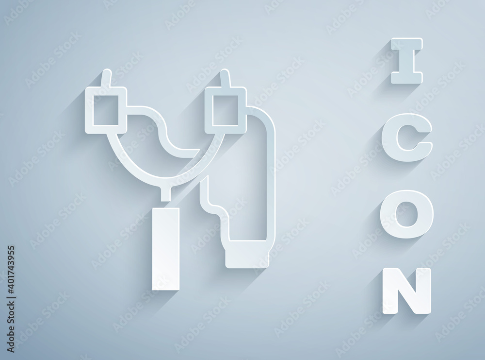 Paper cut Slingshot icon isolated on grey background. Paper art style. Vector. Paper cut Slingshot icon isolated on grey background. Paper art style. Vector.