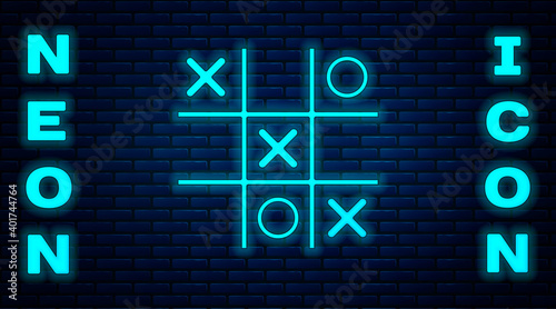 Glowing neon Tic tac toe game icon isolated on brick wall background. Vector.