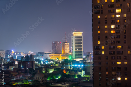 Aerial view of the city of Cairo at night along the river Nile. Skyline of the African city of Egypt photo