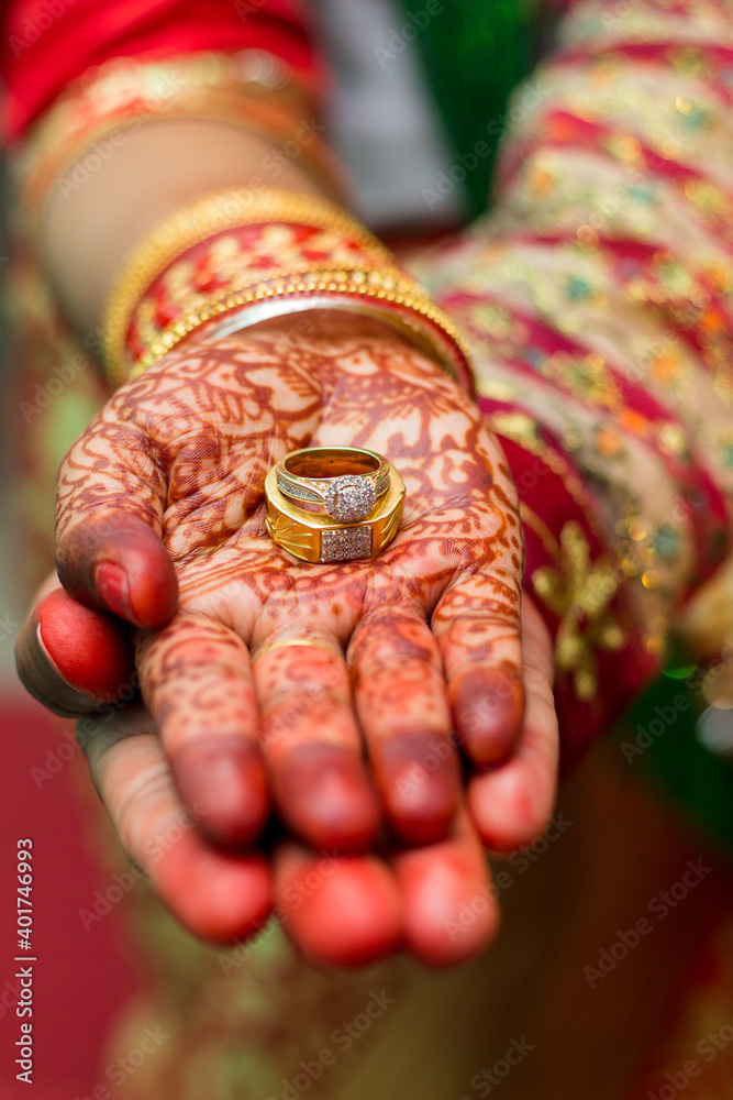 wedding ring and mehendi heena on hands from nepali wedding bride 