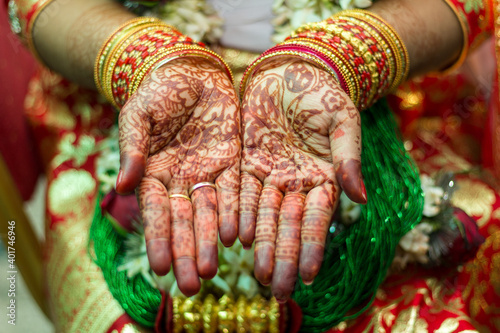 wedding ring and mehendi heena on hands from nepali wedding bride  photo