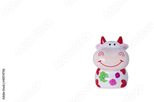 Porcelain cow with flowers. Symbol of the new year.