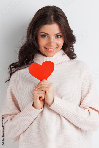 Woman holding paper heart card