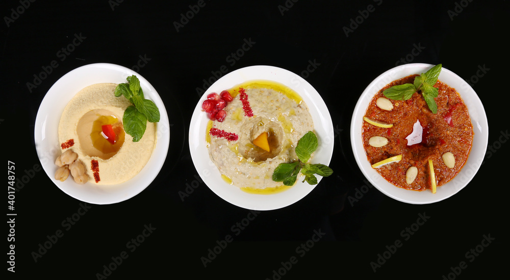Arabic Turkish starter appetizer humus chickpeas eggplant black background Arabic Turkish starter appetizer humus chickpeas eggplant black background