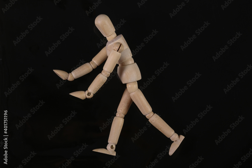 Sad Wooden puppet mannequin isolated on black background Sad Wooden puppet mannequin isolated on black background