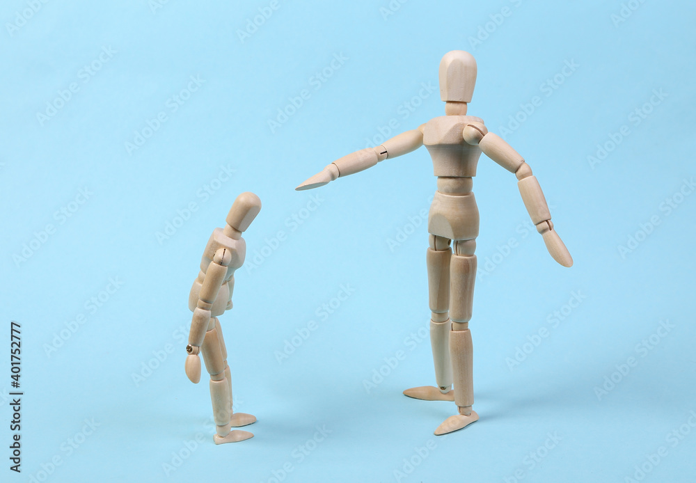 Angry parent puppet points with hand and scolds the child. Negative emotion, teenage problem concept. Isolated on blue Angry parent puppet points with hand and scolds the child. Negative emotion, teenage problem concept. Isolated on blue