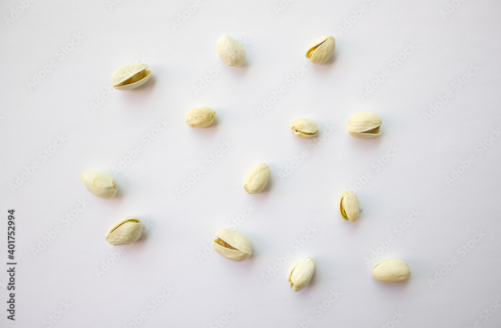 Pistachios isolated on white background, top view. Pistachios isolated on white background, top view.