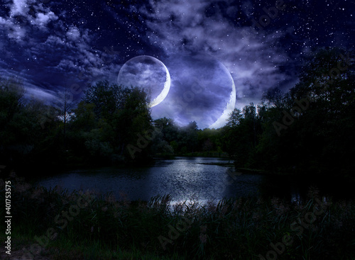 Night sky and double moon on a fabulous cloudy sky © alg2209