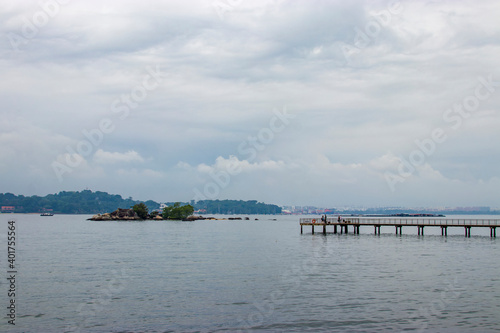 the boardwalk and Frog Island (Pulau Sekudu) in Chek Jawa wetland. It is a cape and the name of its 100-hectare wetlands located on the south-eastern tip of Pulau Ubin island Singapore. 