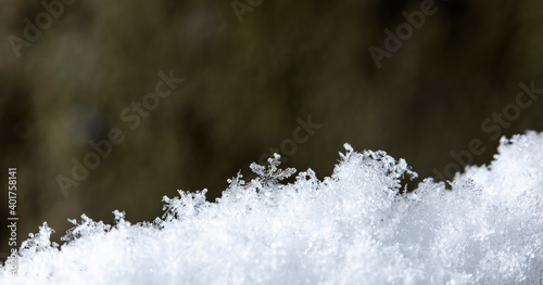 a snapshot of a small snowflake taken during a snowfall © vadim_fl