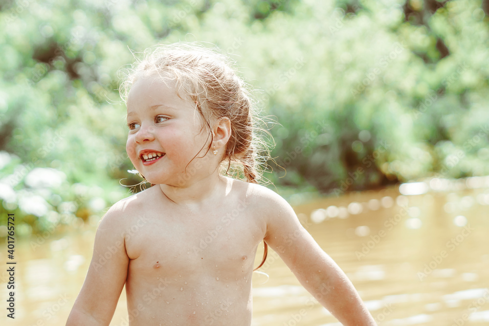 child playing in the river child playing in the river