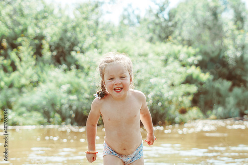 child playing in the river