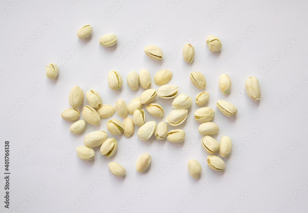 Pistachios isolated on white background, top view. Pistachios isolated on white background, top view.