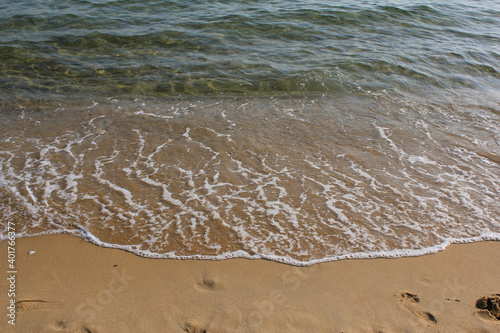 Fototapeta Naklejka Na Ścianę i Meble -  Soft beautiful ocean wave on sandy beach. Background