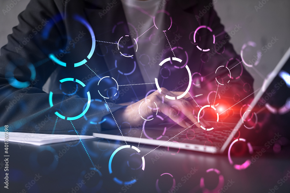 Businesswoman typing on laptop in office. Abstract technology hologram. Double exposure. Businesswoman typing on laptop in office. Abstract technology hologram. Double exposure.