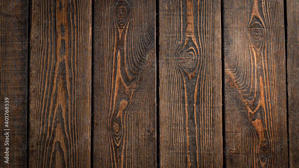 Obraz premium wooden background of brown color from vertical planks