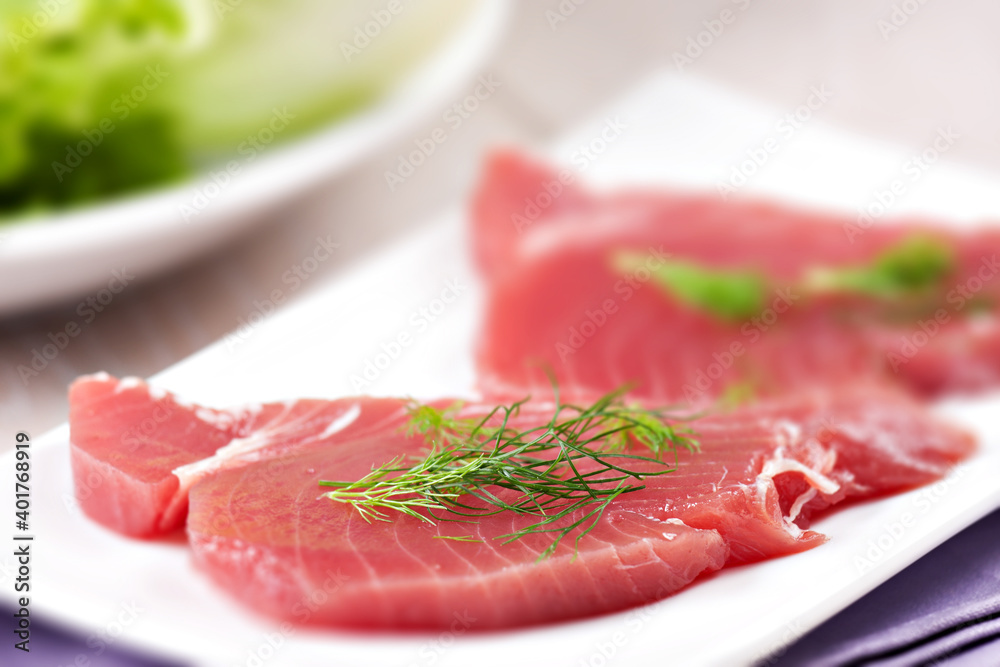 Raw Tuna steak. Raw fish on a plate. Raw Tuna steak. Raw fish on a plate.